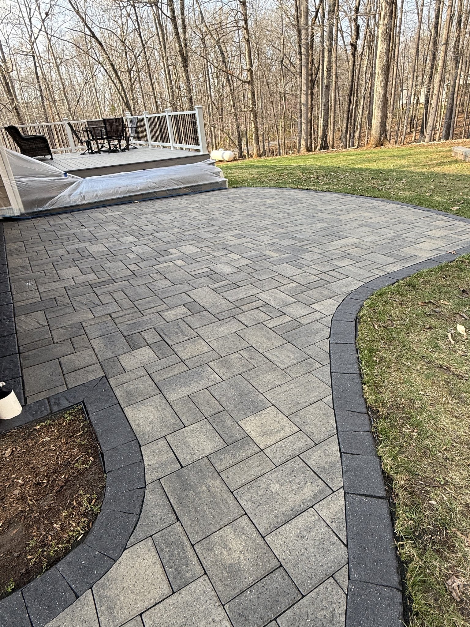 Back paver patio after cleaning, sanding, and sealing