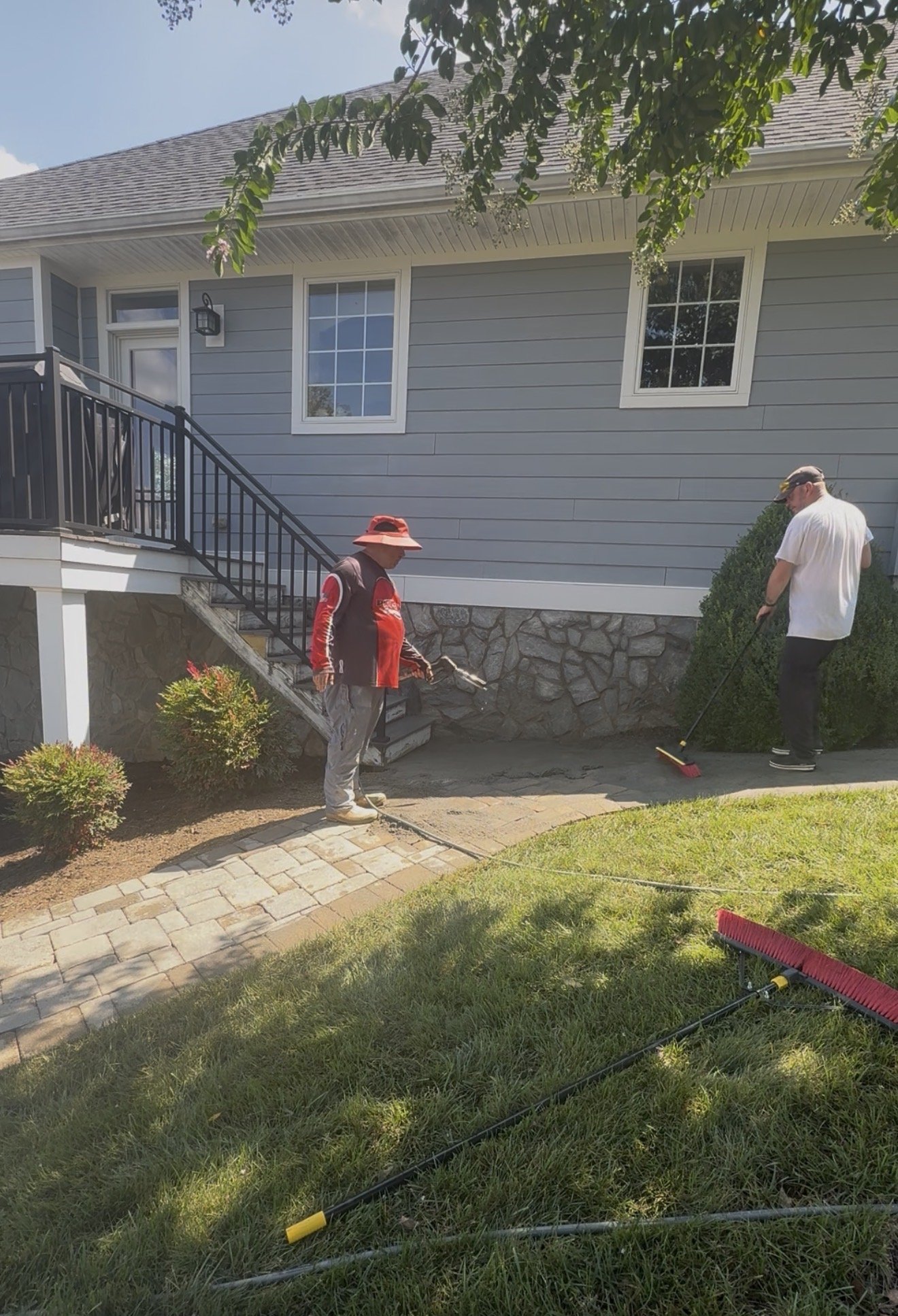 Installing new fieldstone joint sand on the paver walkway in Huddleston, VA