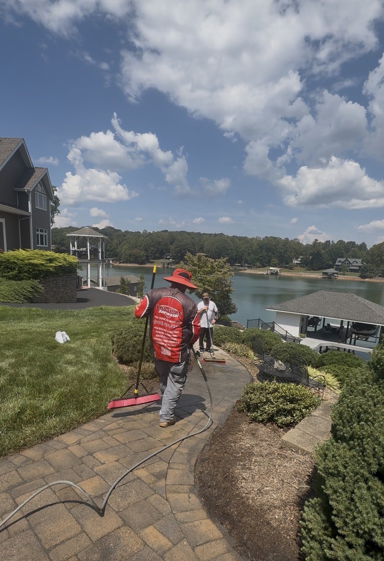 Sweeping new joint sand across the pavers at Smith Mountain Lake
