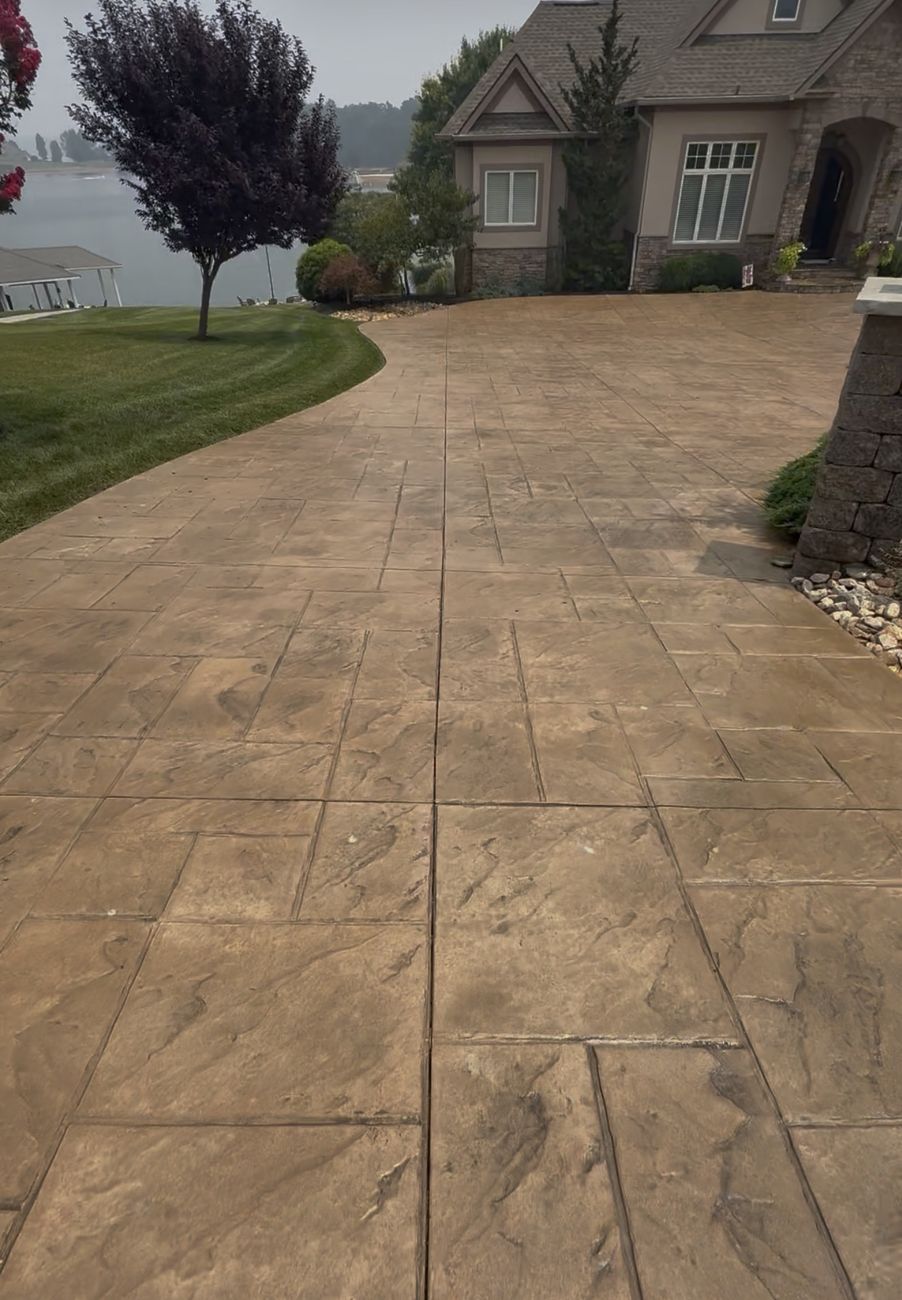 Rich brown sealed stamped concrete with Smith Mountain Lake in the background