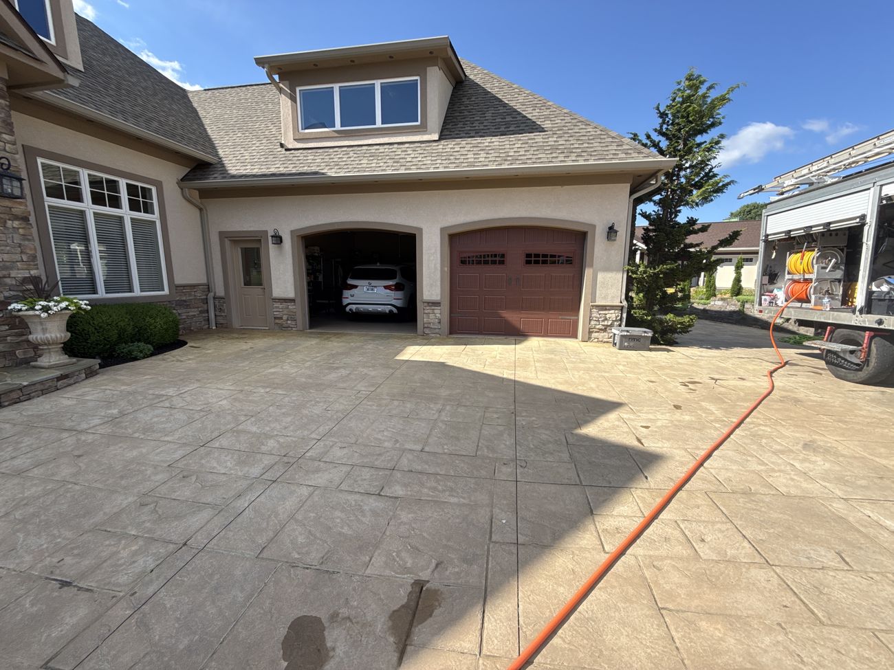 Dull stamped concrete courtyard before cleaning and sealing in Moneta, VA